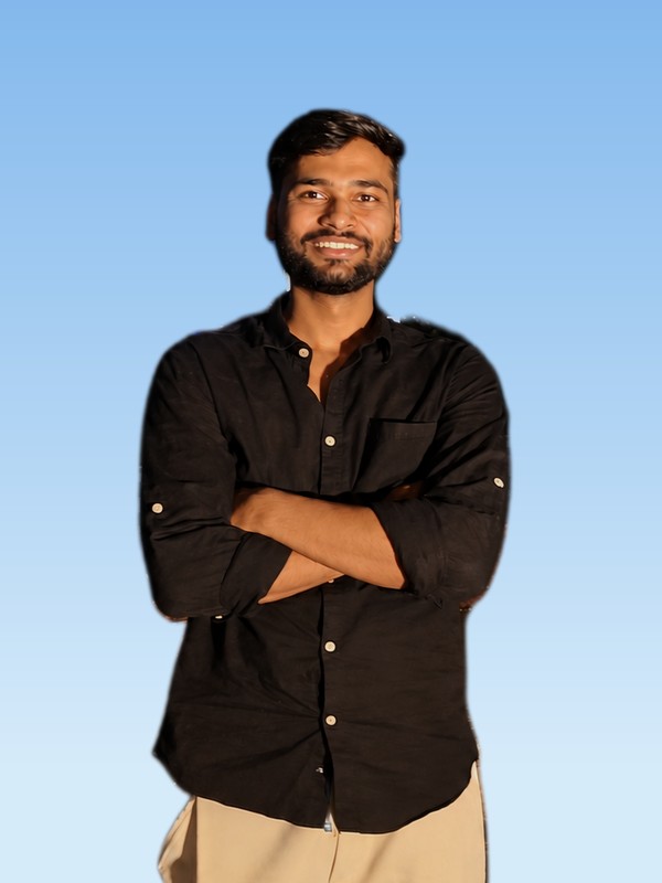 Vaibhav Dwivedi smiling with arms crossed